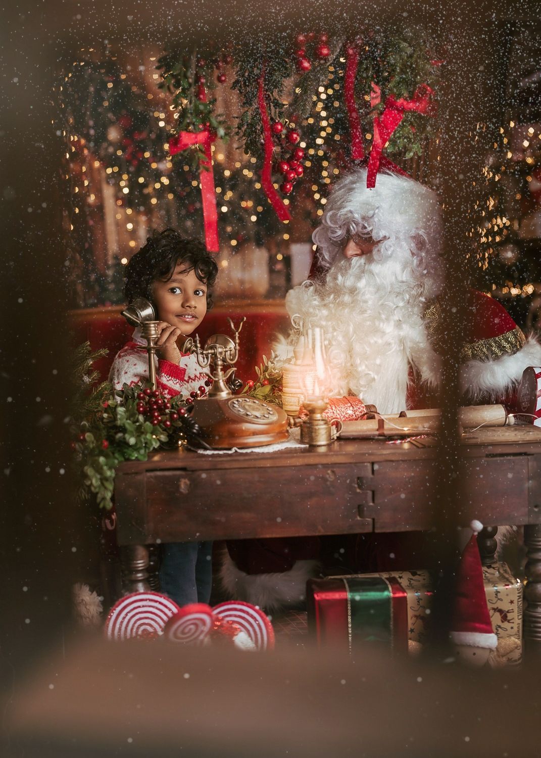 Magical Christmas scene with Santa Claus and sparkly holiday decorations at wooden table.