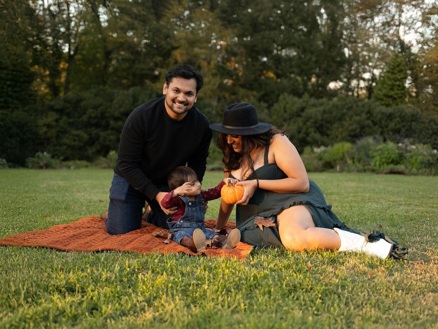 Family precious moments during golden hour photoshoot in the park