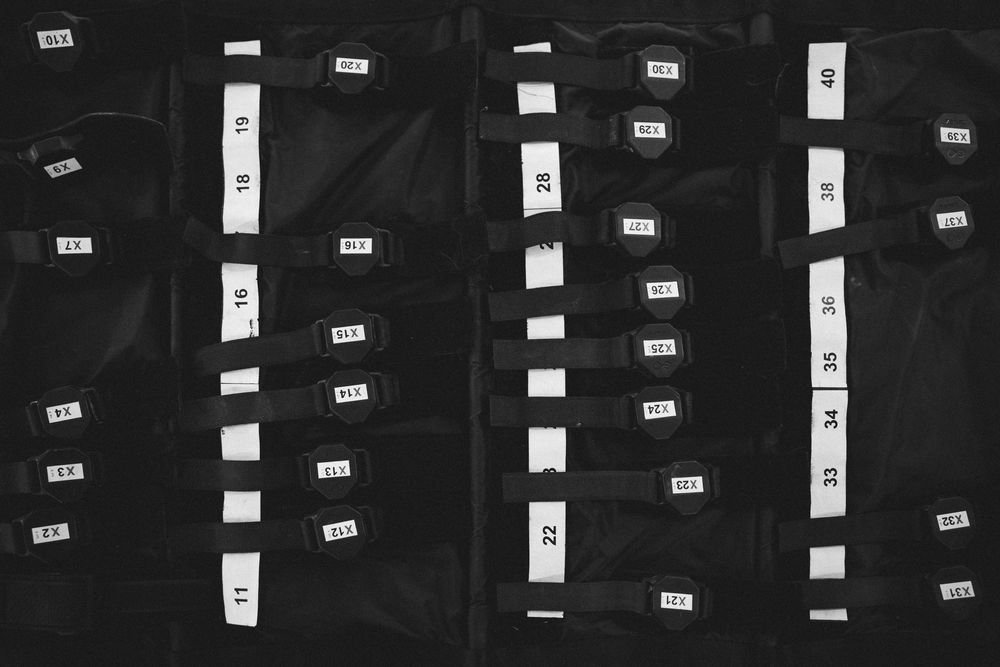 A panoramic collection of film strip negatives arranged vertically with frame numbers visible on a dark background.