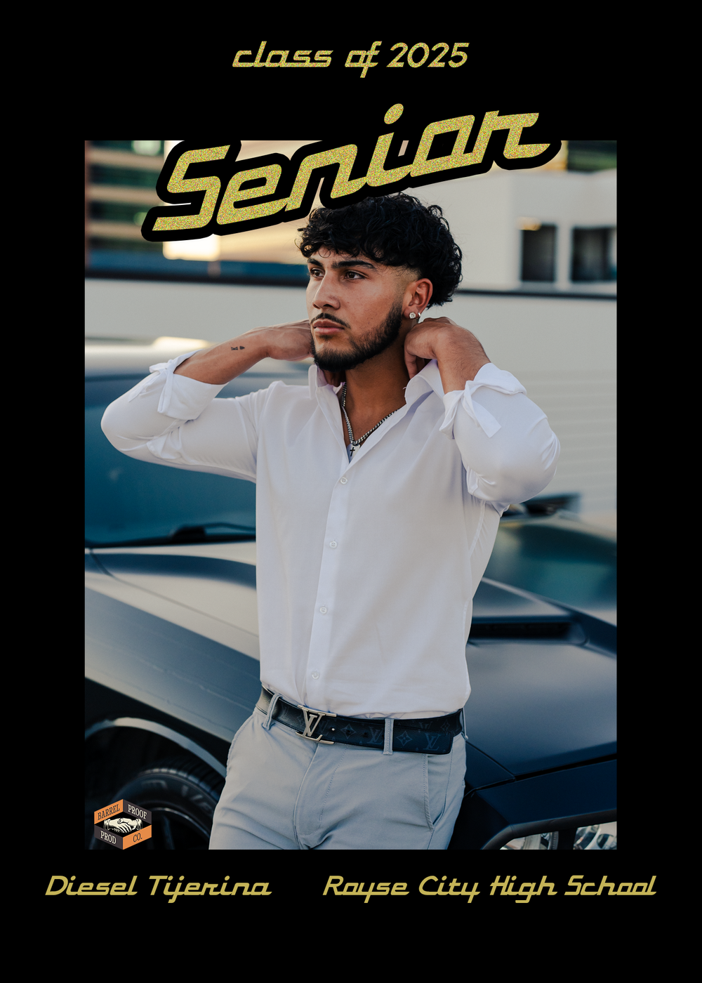 High school senior in white button-down shirt poses near parked cars for graduation photos in outdoor setting.