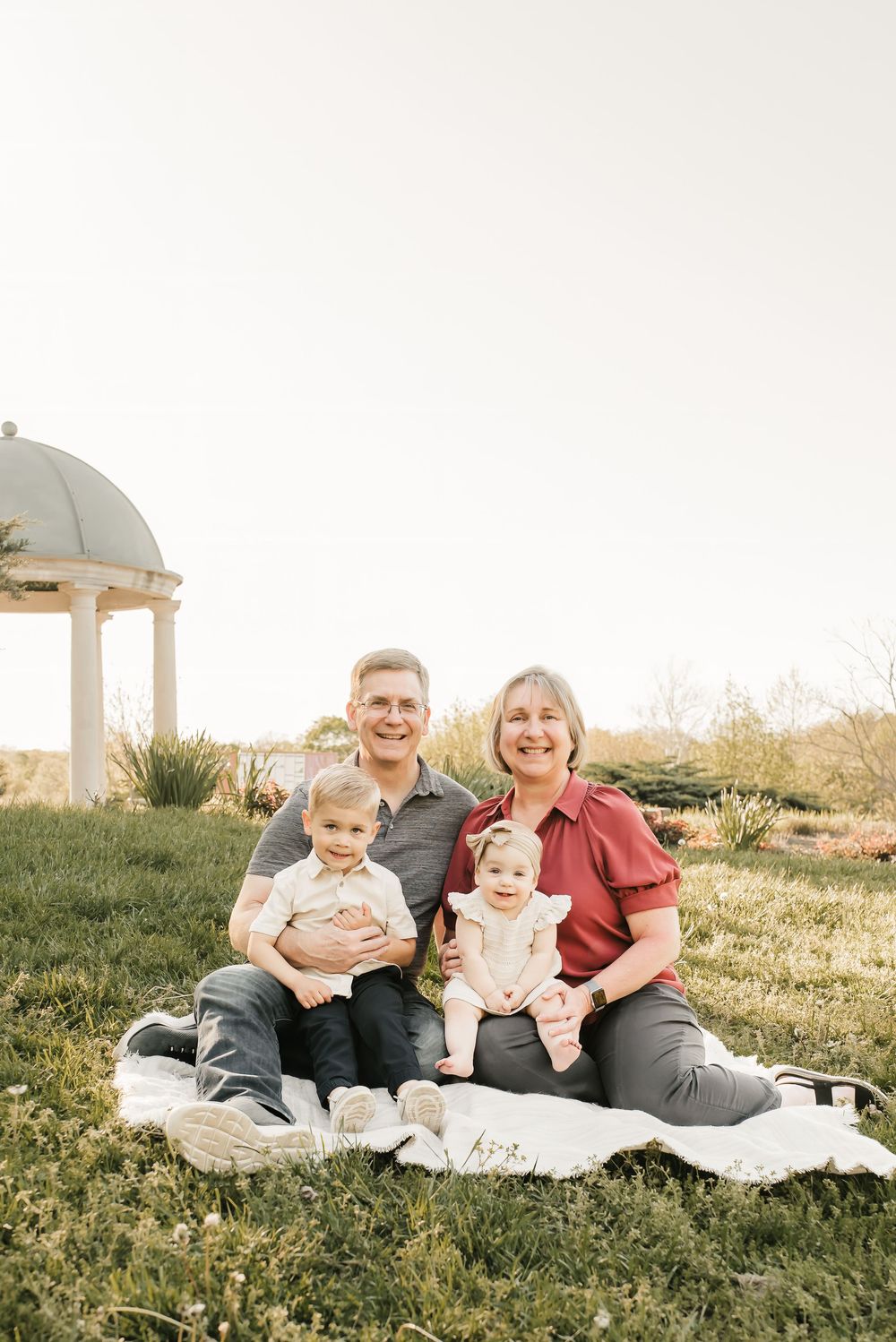 grandparents cuddle their grandkids at park in cincinnati