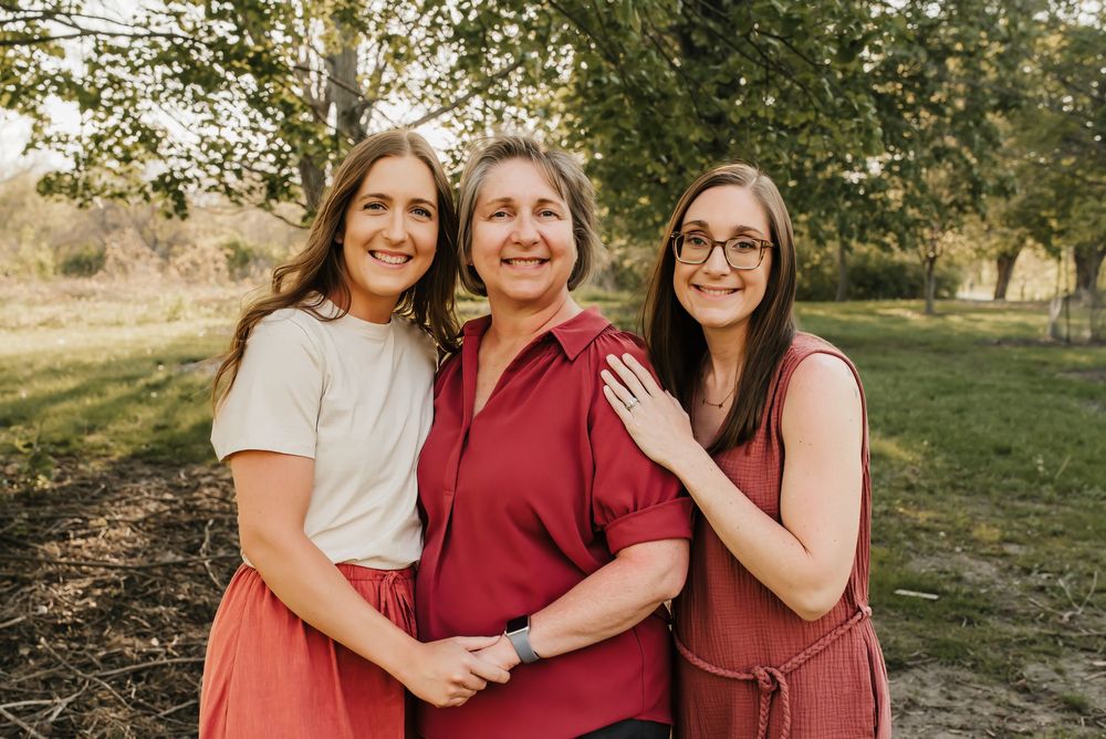 mom and daughters smile