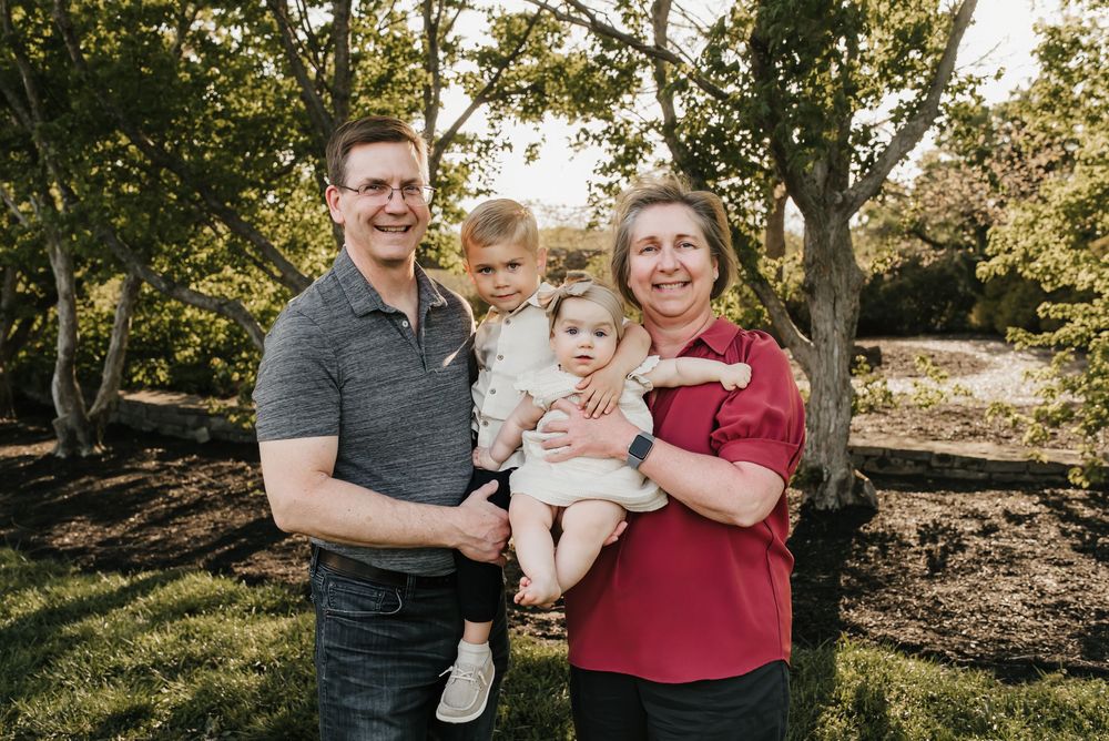 grandparents cuddle their grandkids at Glenwood gardens in cincinnati