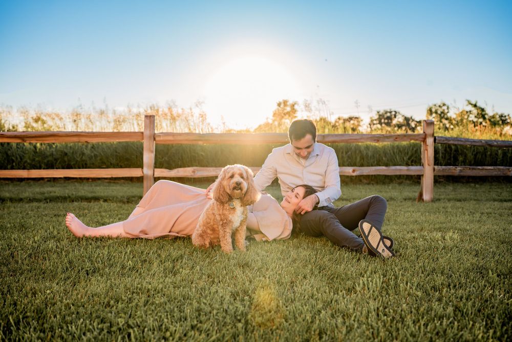 Flowing maternity gown on a pregnant woman, captured during a sunset maternity session.