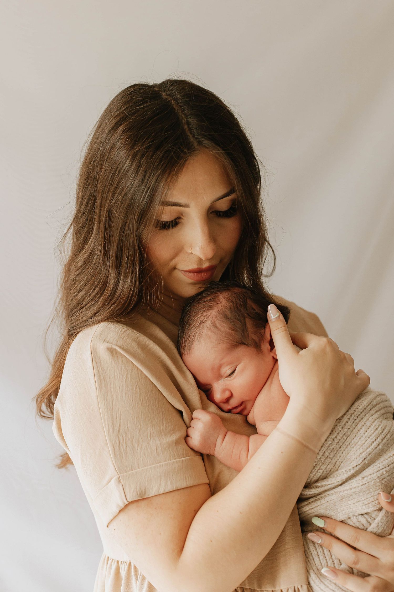 Mother and newborn in home photoshoot in Ashford Kent