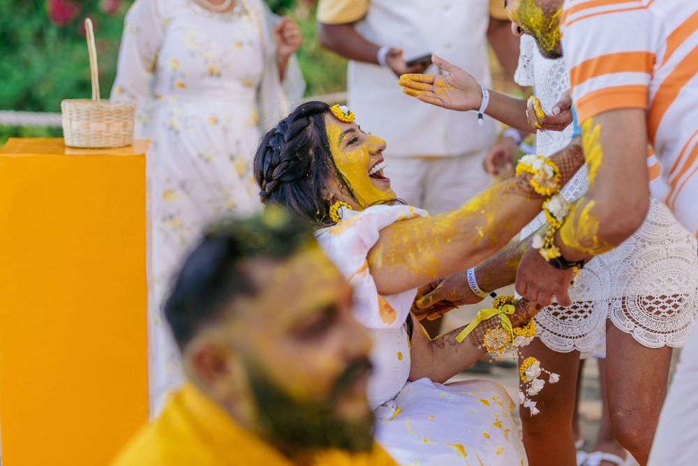 Joyful celebration moment at outdoor party with yellow decor.