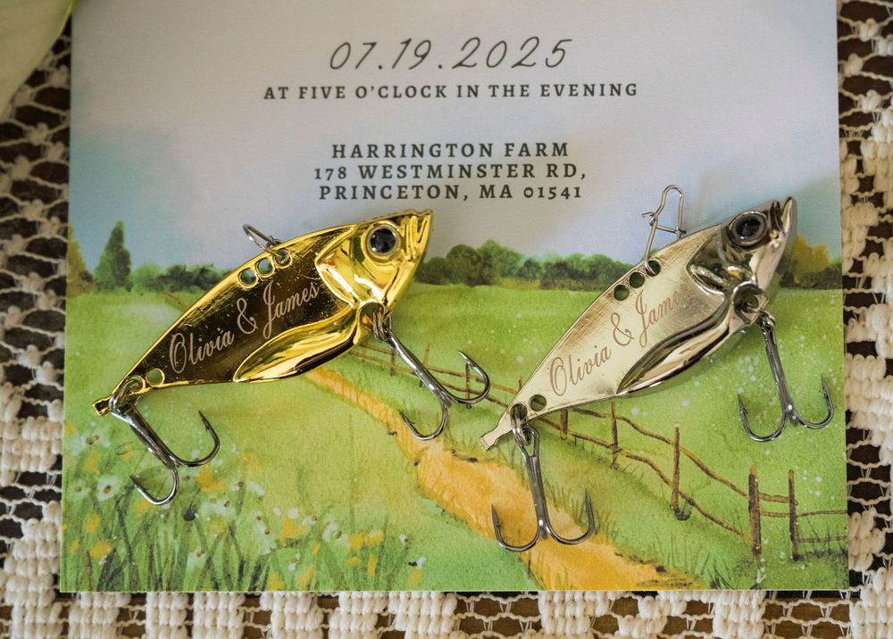 Save the date invitation featuring two vintage fishing lures on a watercolor background with event details.