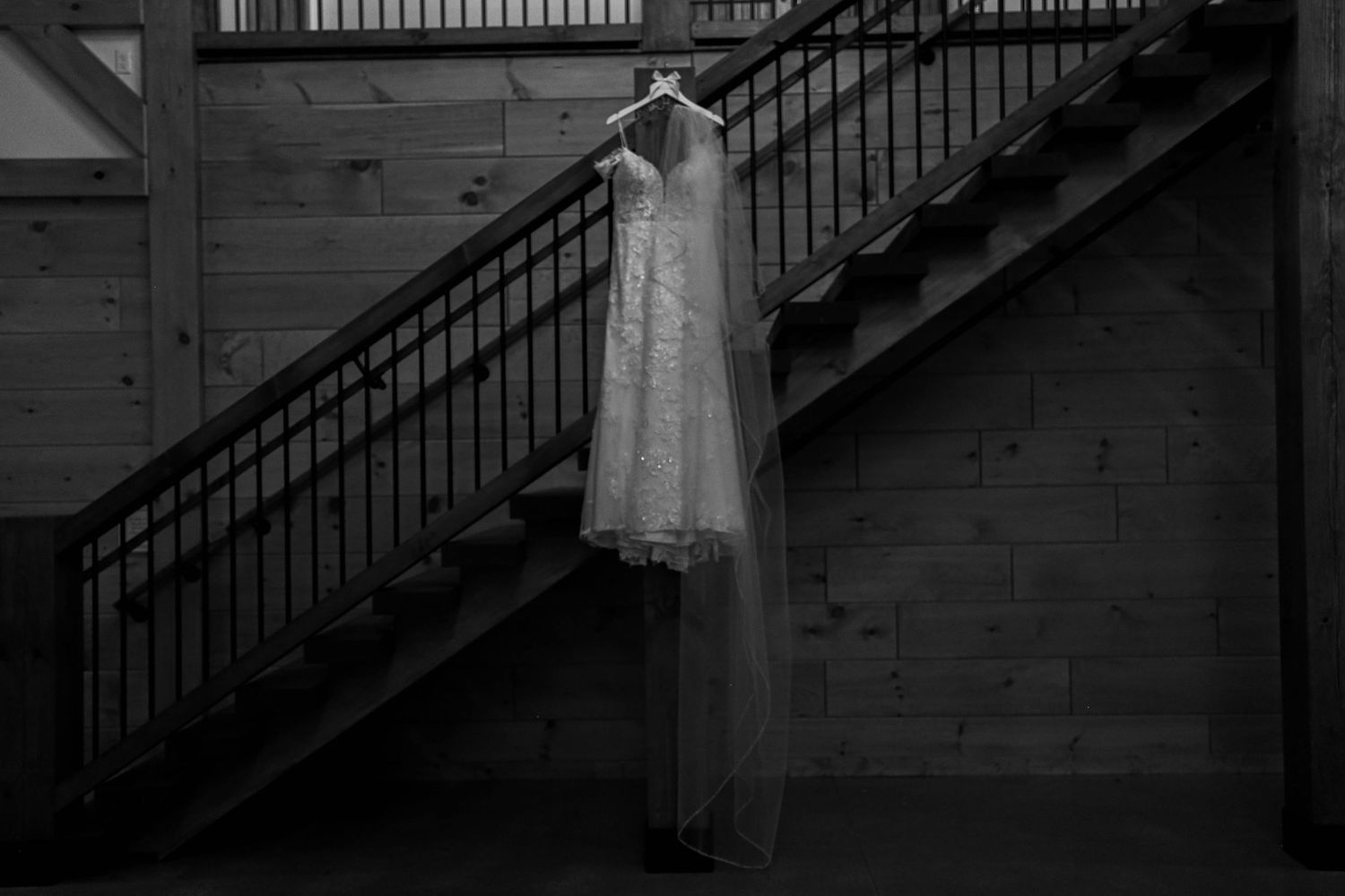 Dramatic black and white architectural photos of a staircase with minimalist wedding portraits.