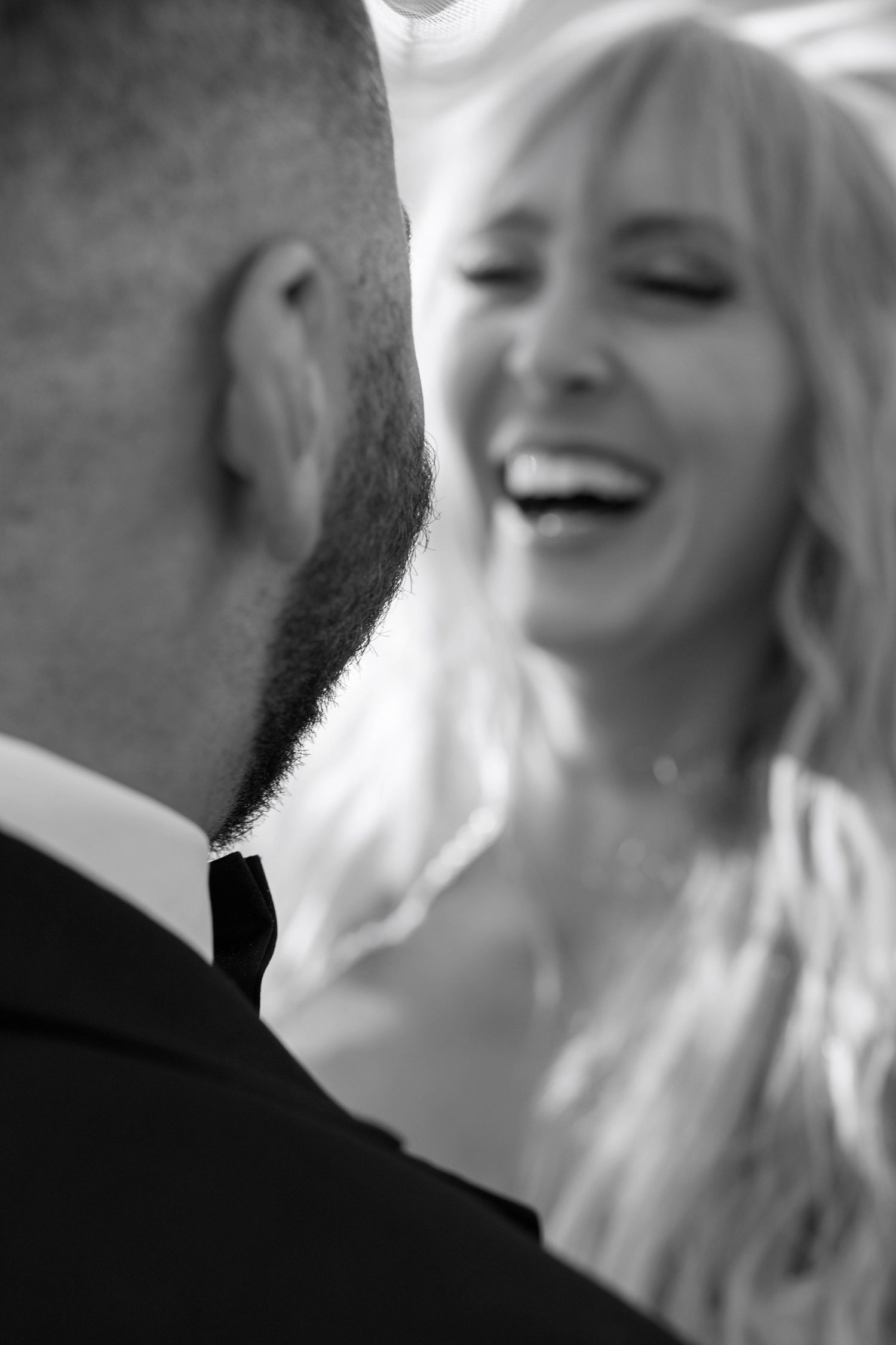Close up sequence of joyful wedding moments showing laughter and happiness between a bride and groom.