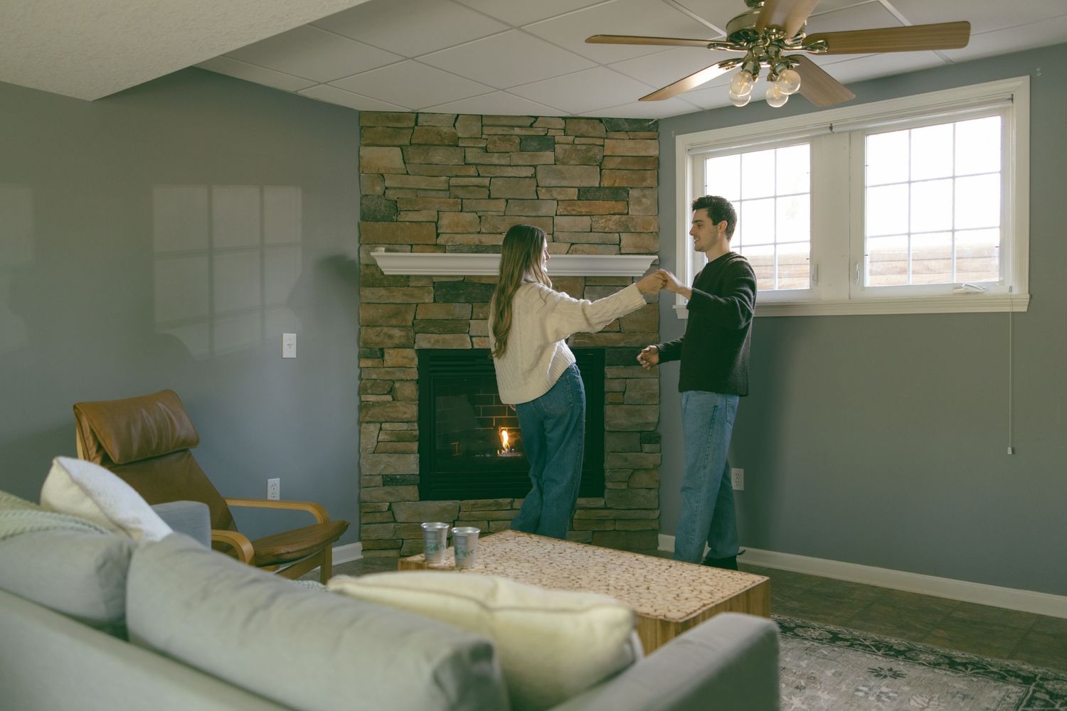 new home asheville photoshoot couples empty house lifestyle session fireplace dancing celebrating