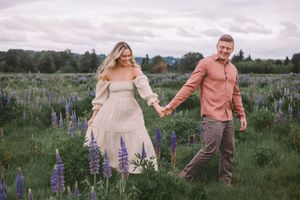 couples elopement photoshoot in lupine wildflower fields of Washington