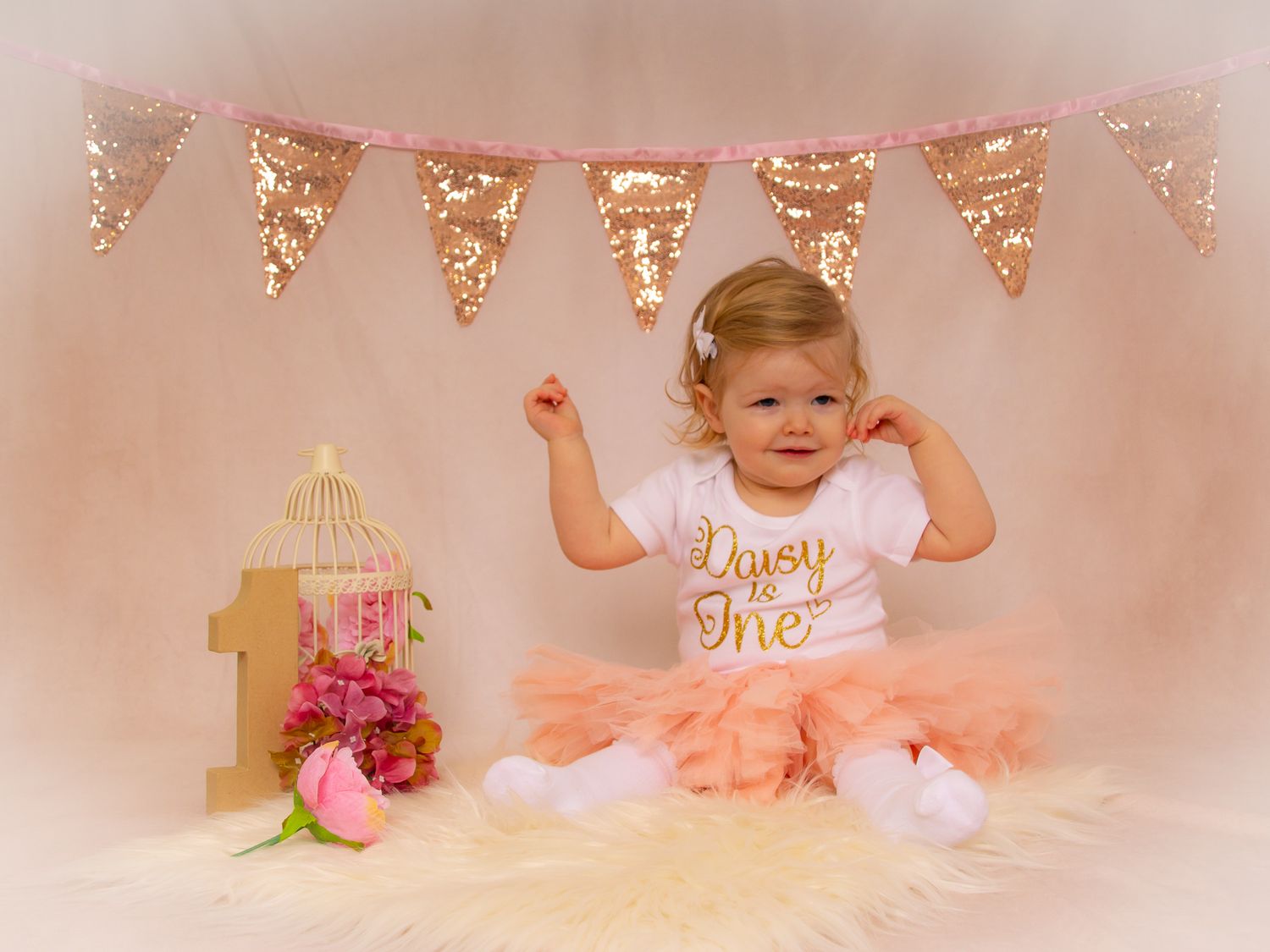 A pink and gold first birthday cake smash photo session collage featuring tulle dress and sparkly decorations.