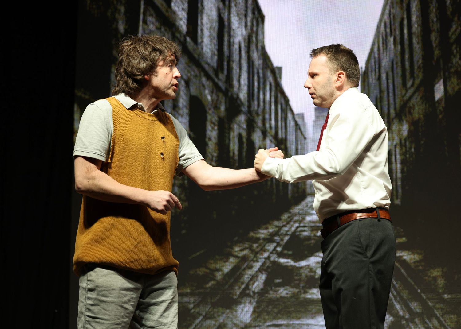 Multiple frames showing two figures interacting in a dark urban alleyway or corridor.