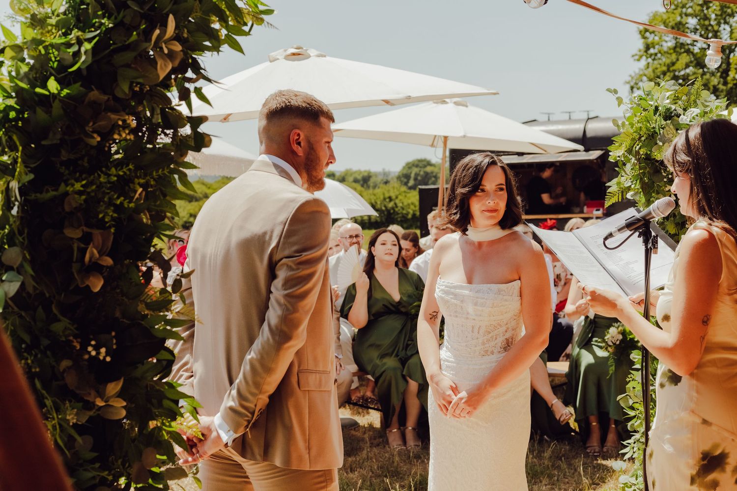 A wedding couple during their ceremony on a sunny day, an emotional documentary wedding photography