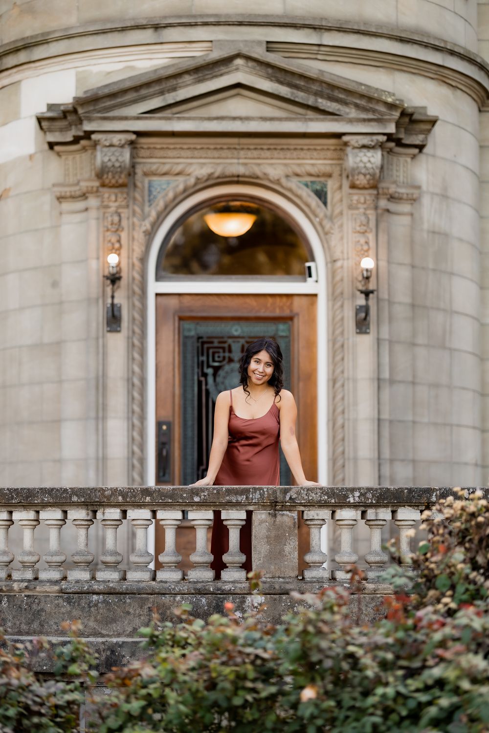 A stone archway entrance with elegant architectural details and decorative moldings at a historic building.