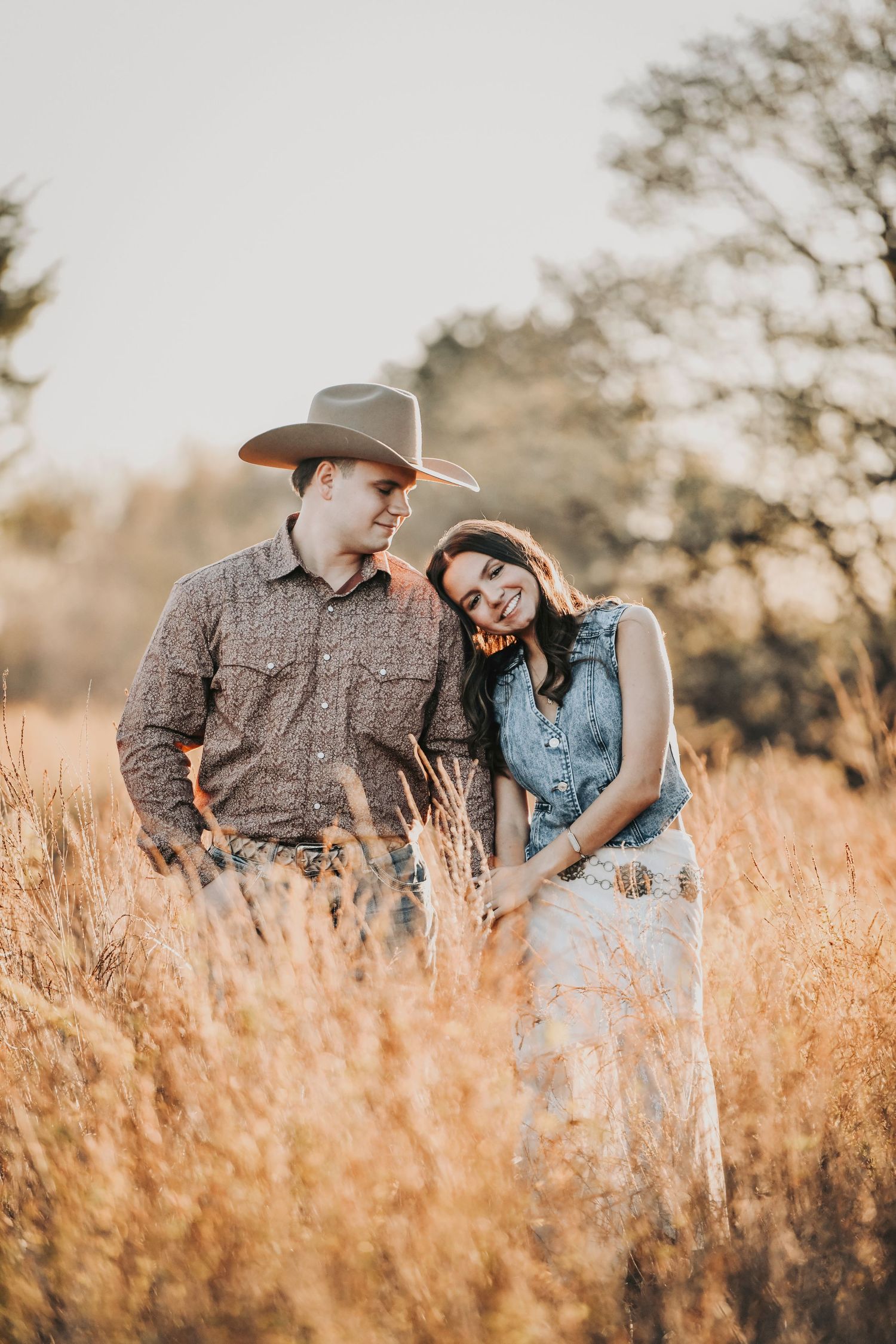 Natural sunset engagement photos featuring soft light and a relaxed, romantic mood
