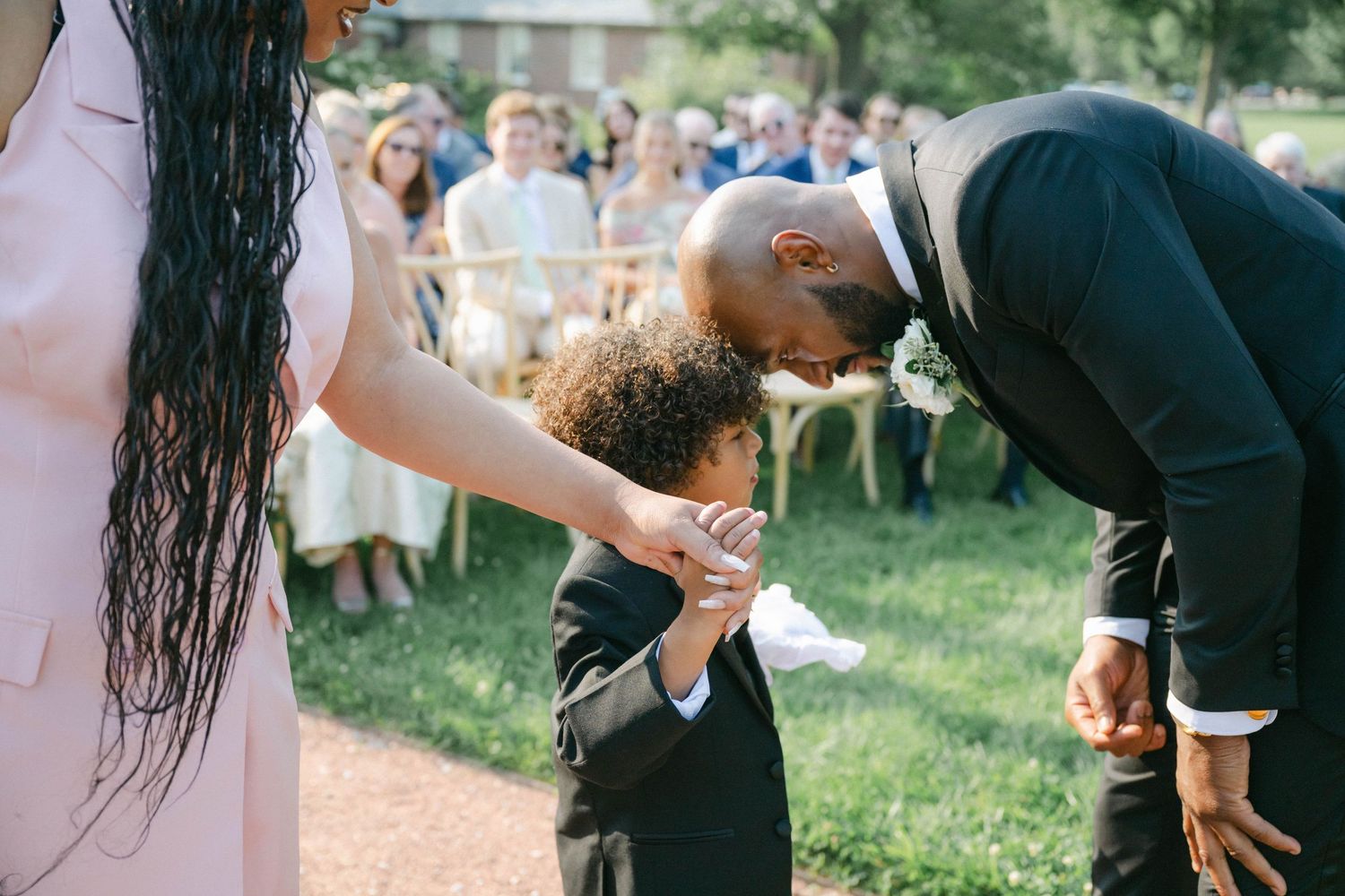 A collection of candid wedding moments showing guests and the couple celebrating during an outdoor garden reception. - Elawa Farm