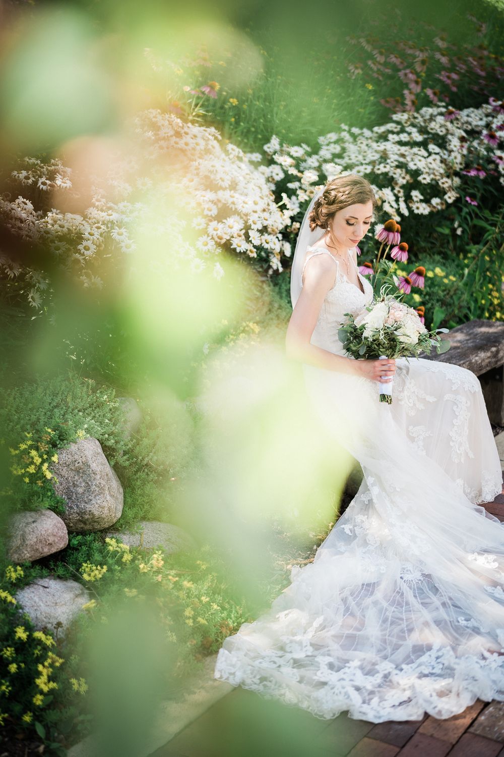 Portrait of bride in garden at wedding venue at Fishermen's Inn in Elburn, Illinois.