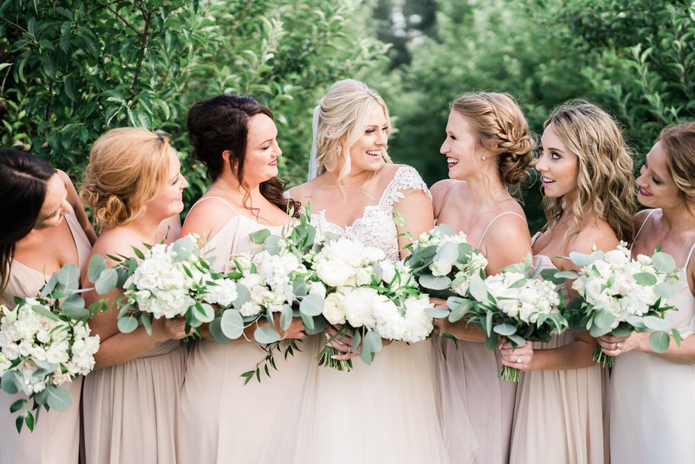 Bright and airy portrait of bridesmaids at wedding venue County Line Orchard in Northwest, Indiana.