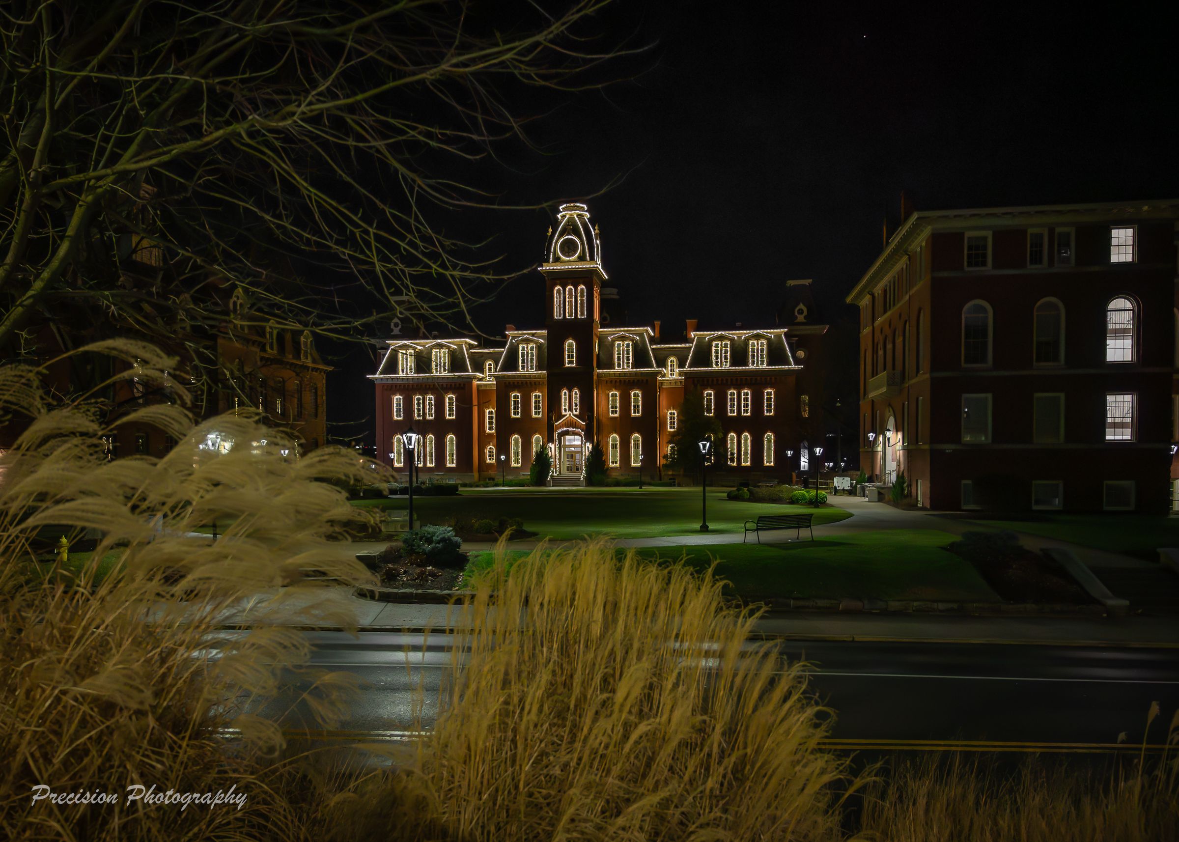 Historic mansion illuminated at night with ornate architecture and glowing windows across multiple nighttime views.