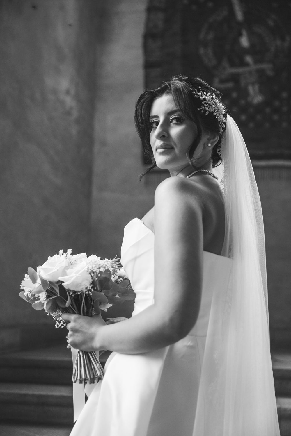 A black and white sequence of bridal portraits showing a bride in a strapless gown holding a bouquet.