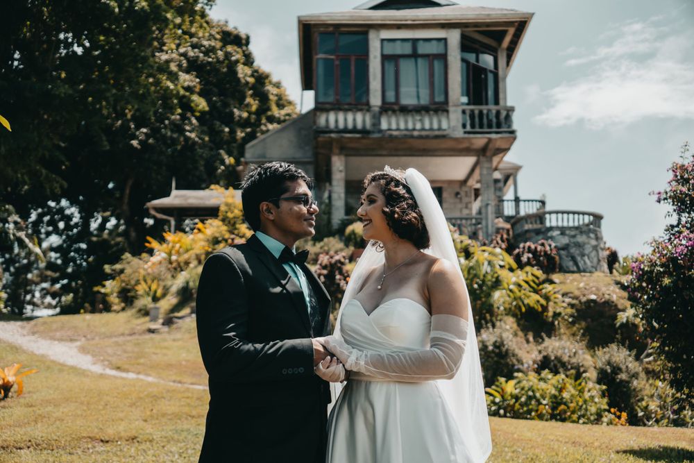 A couple shares an intimate moment in front of  Mahogany Ridge on their wedding day.