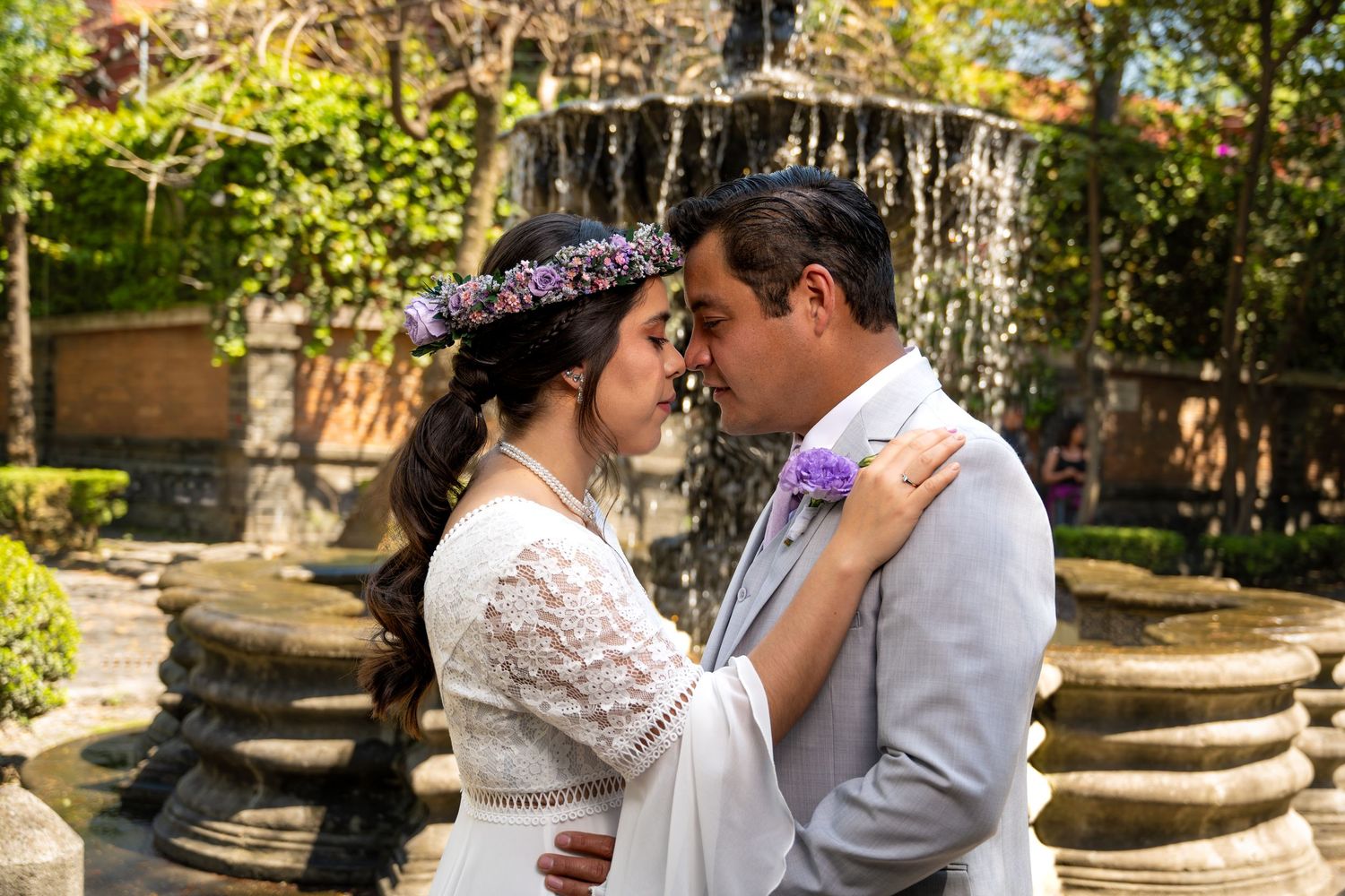 Romantic wedding portraits taken in a rustic barn setting with natural lighting.