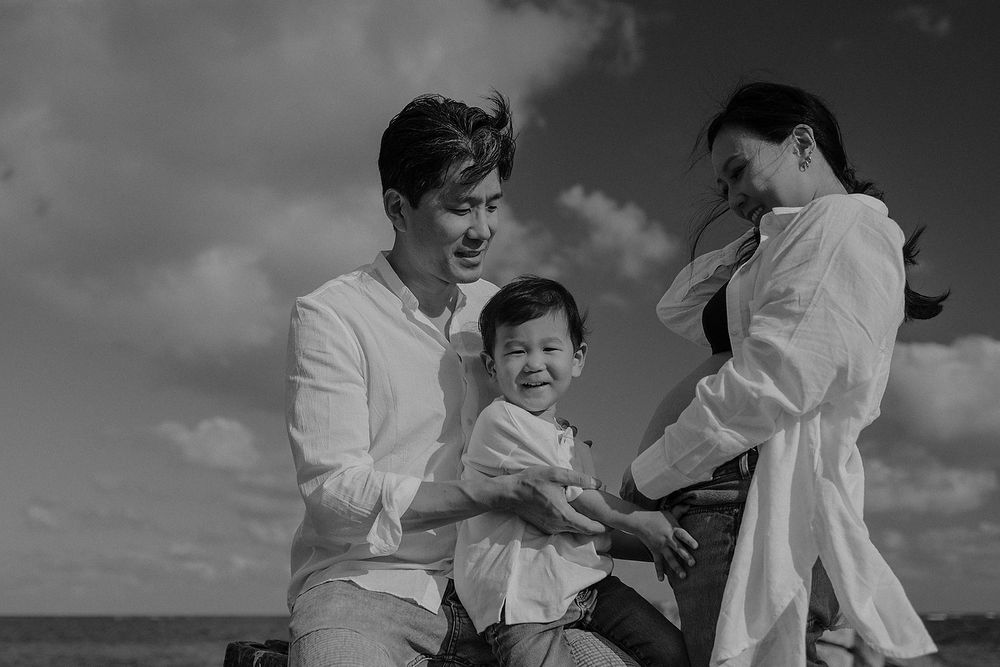 Editorial family pregnancy photoshoot at the Caribbean shore.