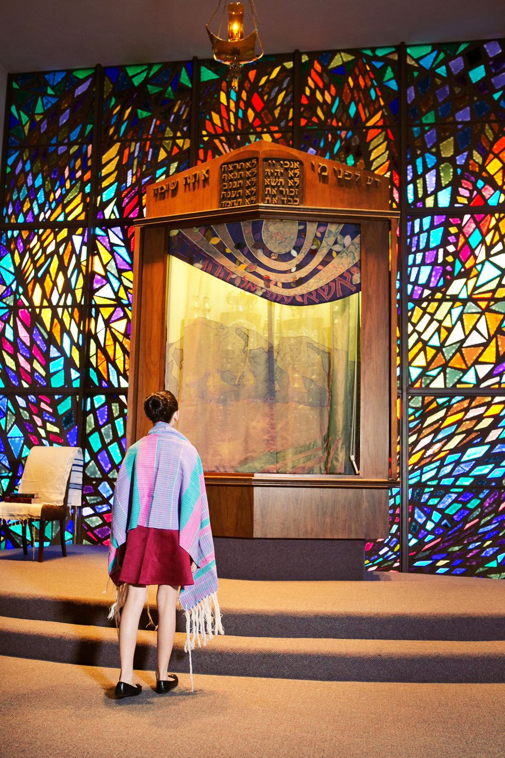 Wide angle photo taken at Congregation Anshei Israel in Tucson.  A girl wearing her colorful Bat Mitzvah tallit.