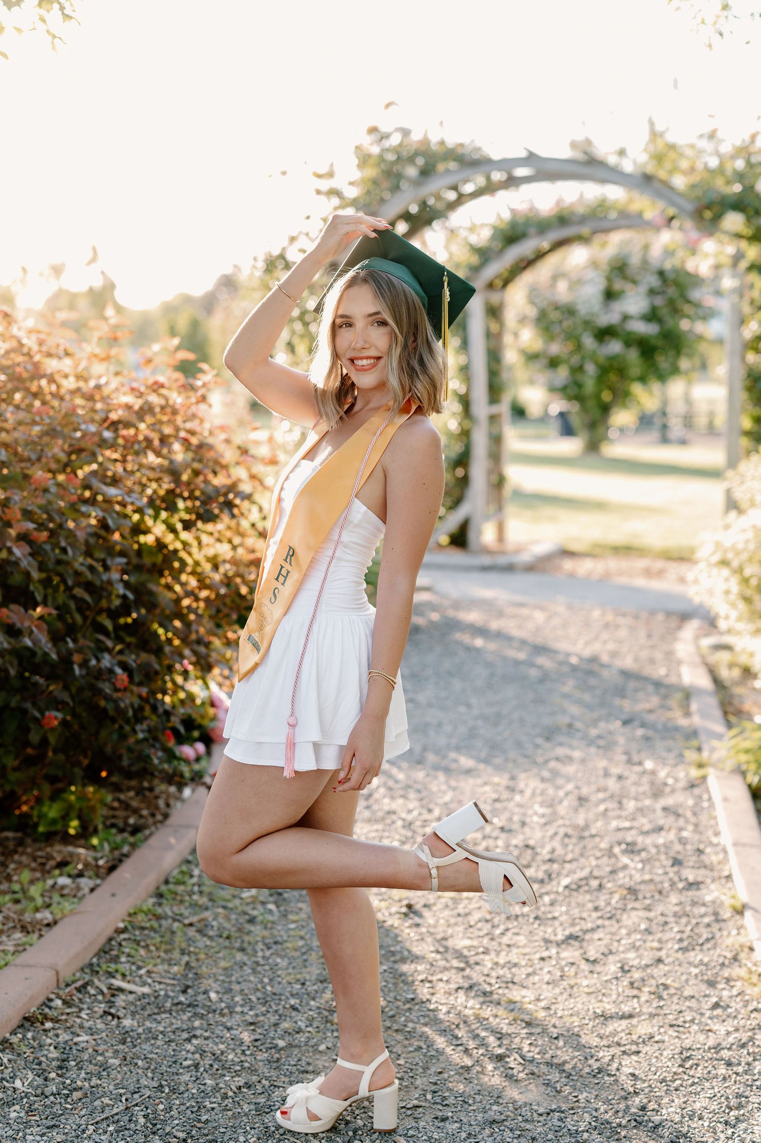 Garden senior pictures in the spring at golden hour