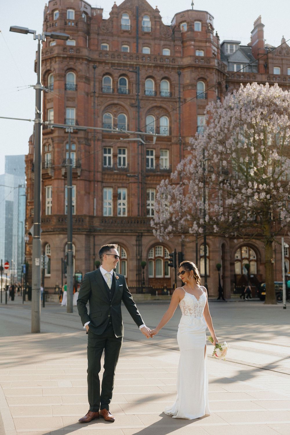 Candid wedding photos of bride and groom in Manchester at the Midland Hotel