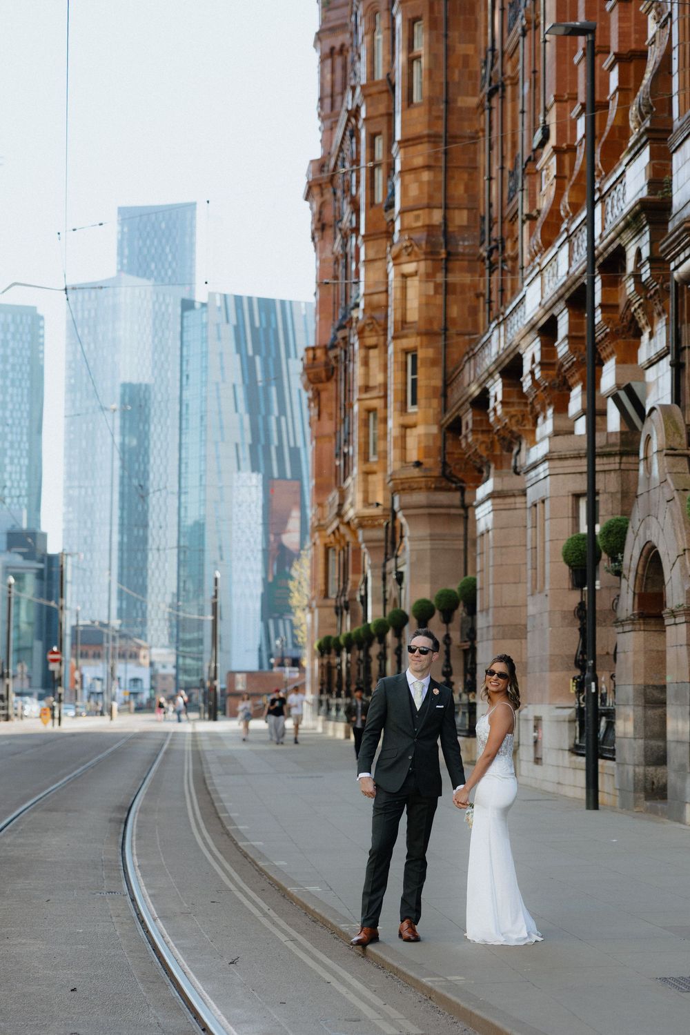 Candid wedding photos of bride and groom in Manchester at the Midland Hotel