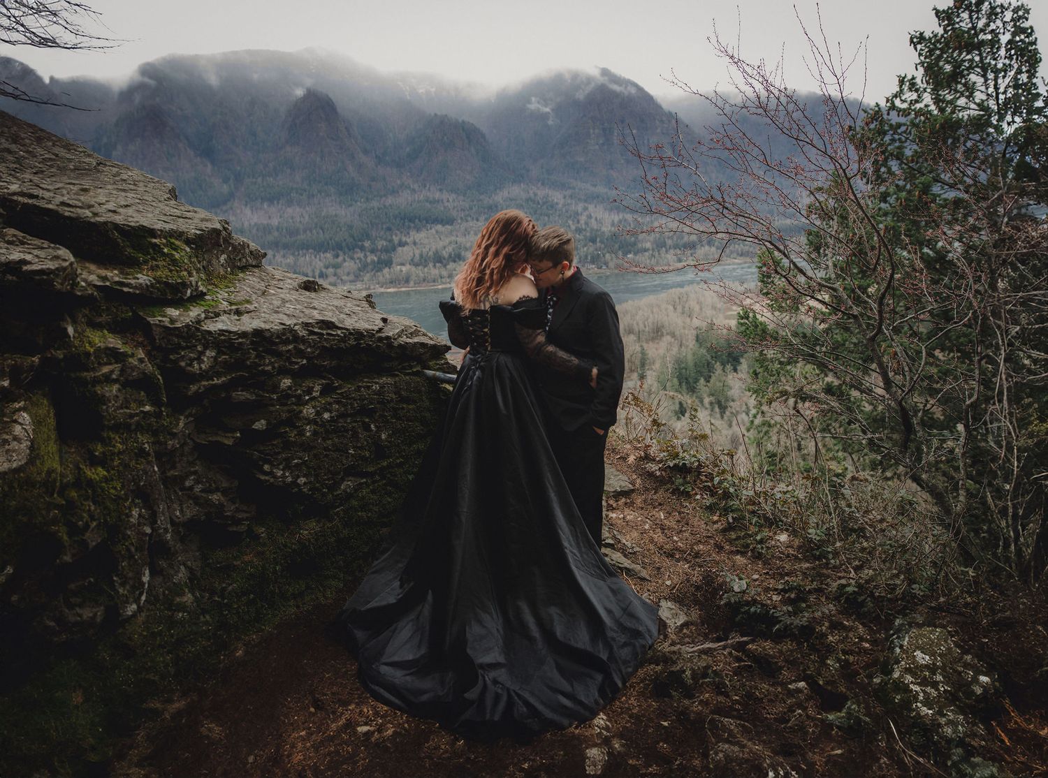 LGBTQ elopement with black dress at Beacon Rock in Washington.
