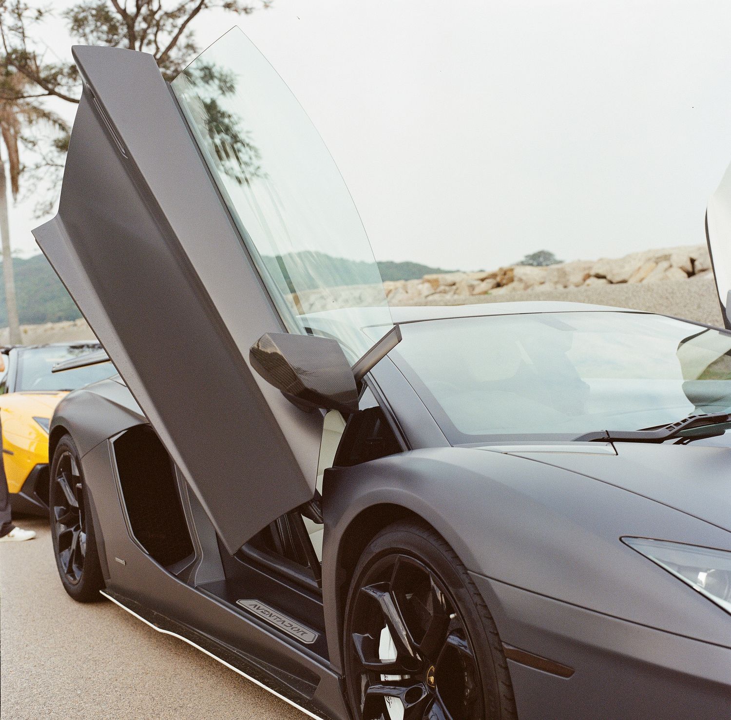 A side detail photo of a Lamborghini Aventador, automotive photography.