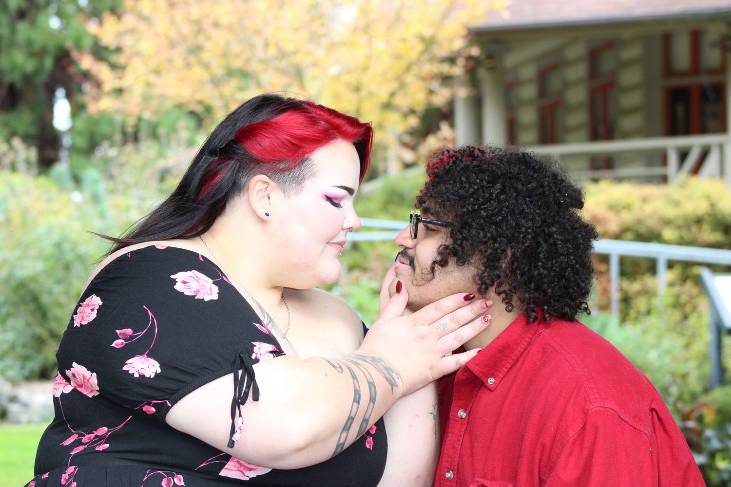 Couple sharing an intimate moment during an outdoor portrait photography session