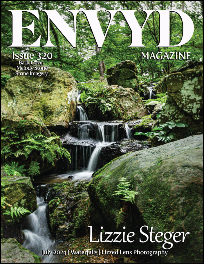 ENVYD Magazine Issue 320 cover featuring a serene waterfall cascading over moss-covered rocks surrounded by lush green ferns.