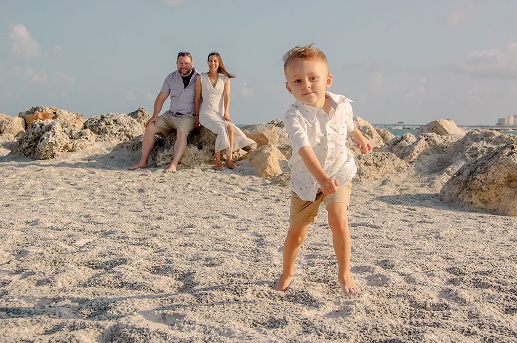 photo of boy running from parents in New Port Richey