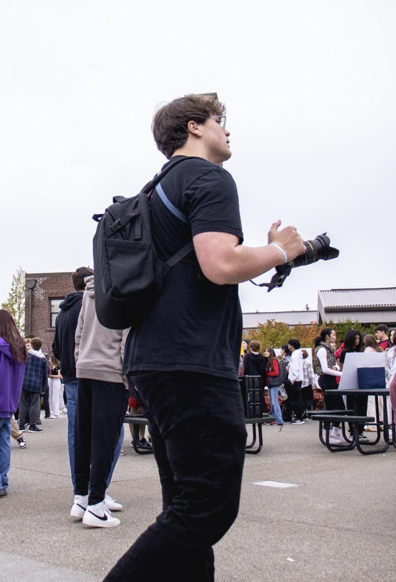 Casey O'Flaherty holding his camera.