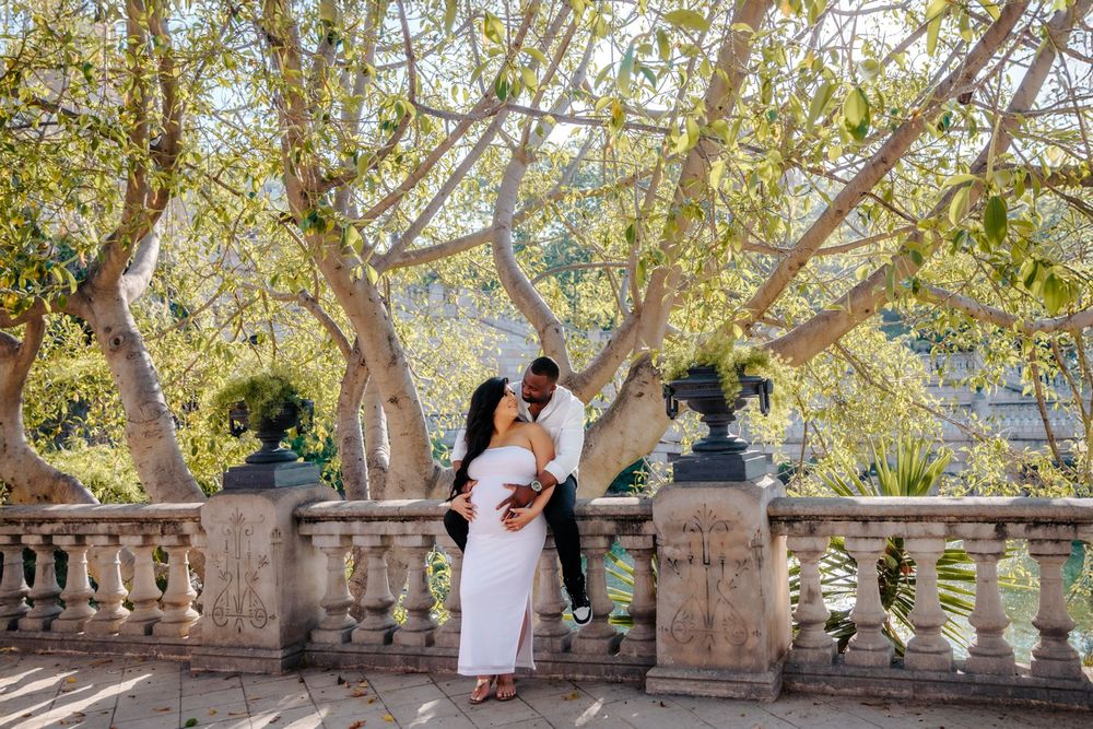 Anna glowing in Casa Vicens while holding her baby bump.