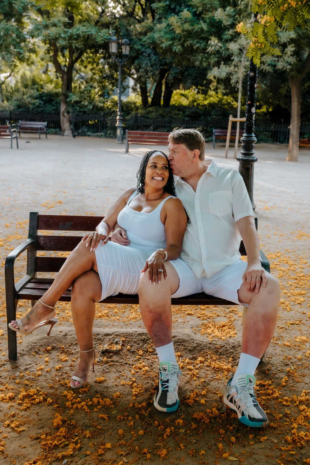 Tender forehead touch captured during their anniversary session in Sagrada Familia.