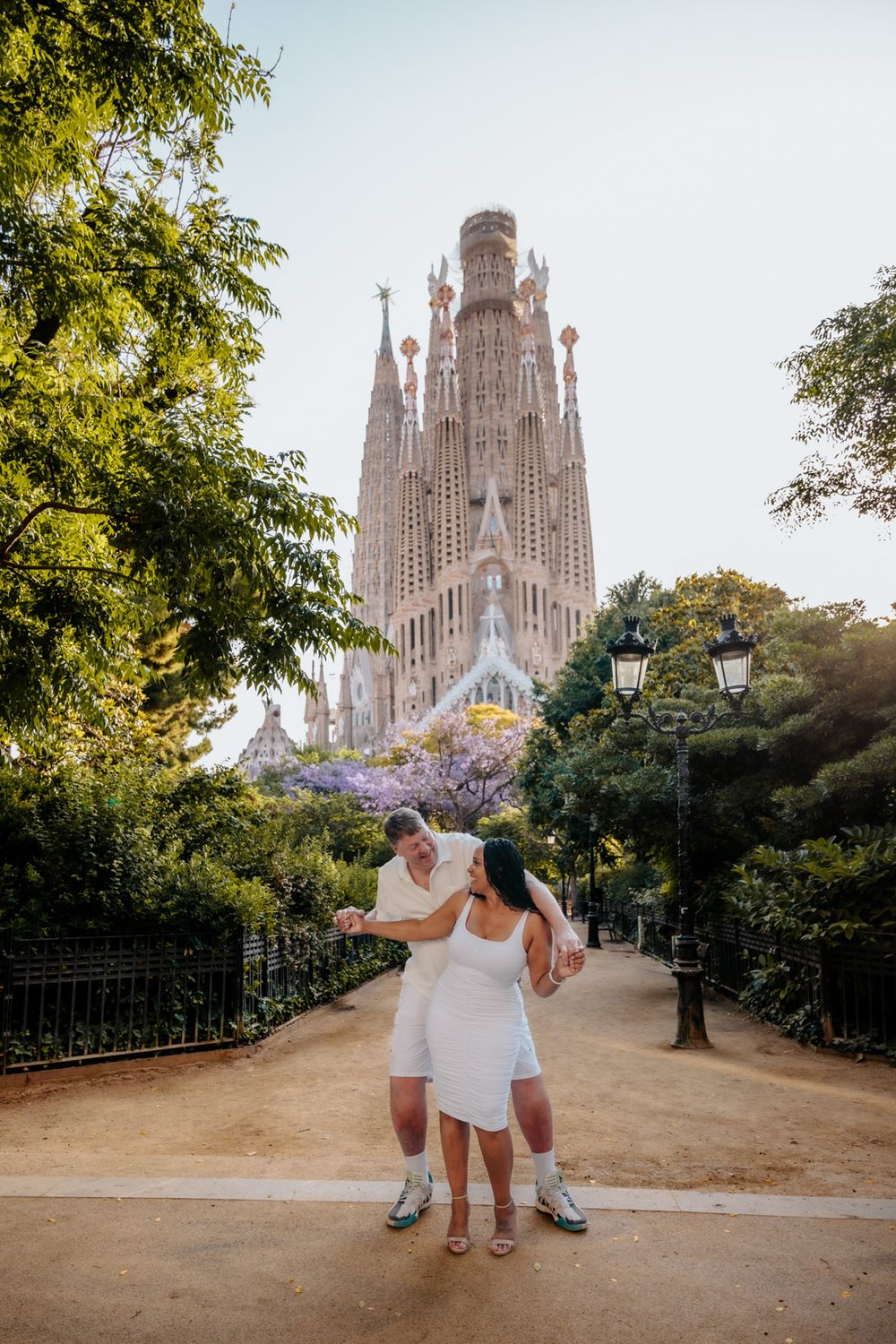 Romantic portrait of Raquel & Greg framed by Sagrada Familia’s magnificent columns.