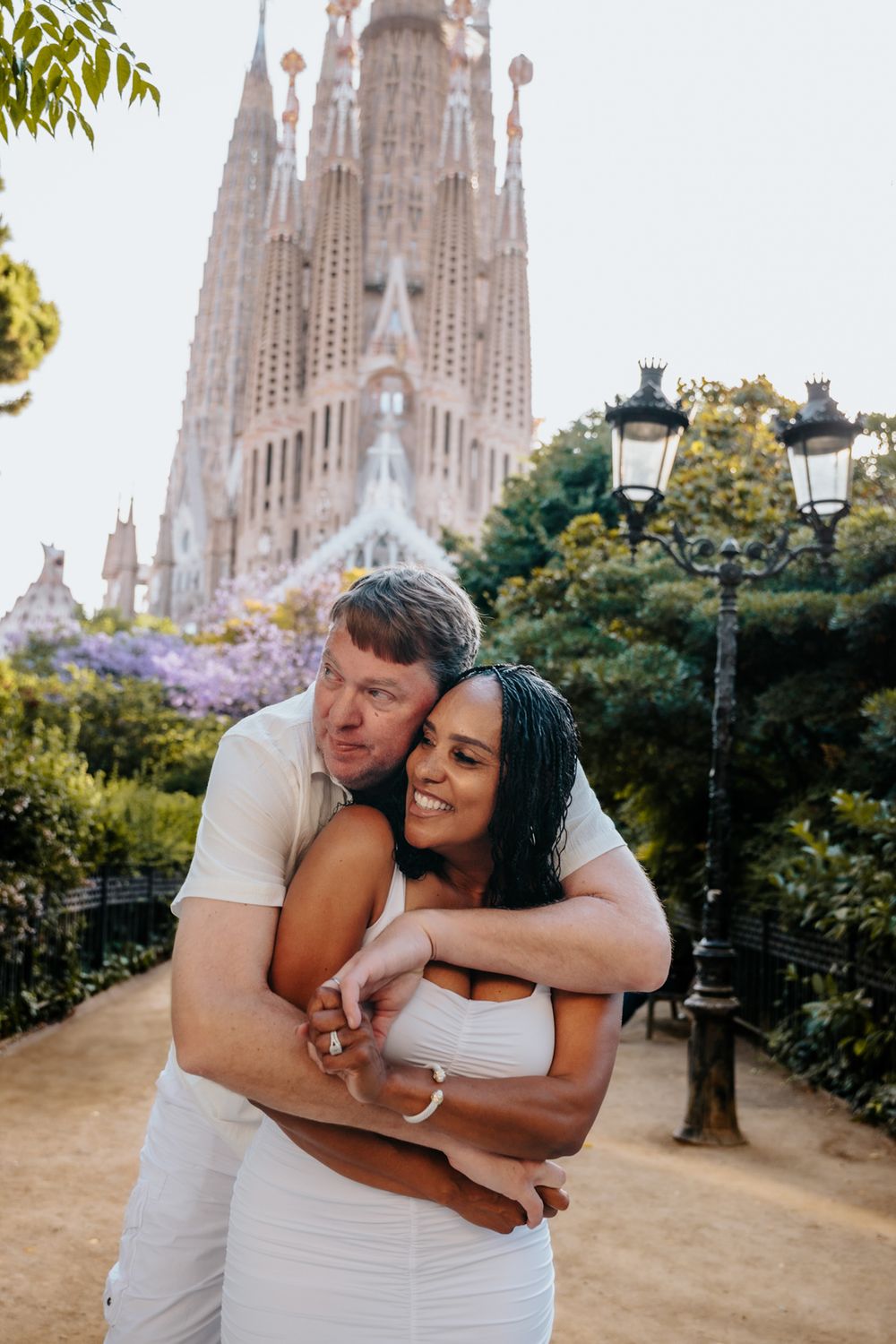 Candid laughter of the couple during their anniversary session in Sagrada Familia.