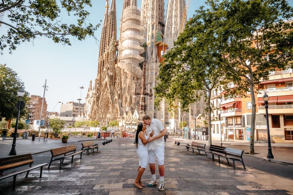 Raquel & Greg smiling together during their anniversary photoshoot in Sagrada Familia, Barcelona.