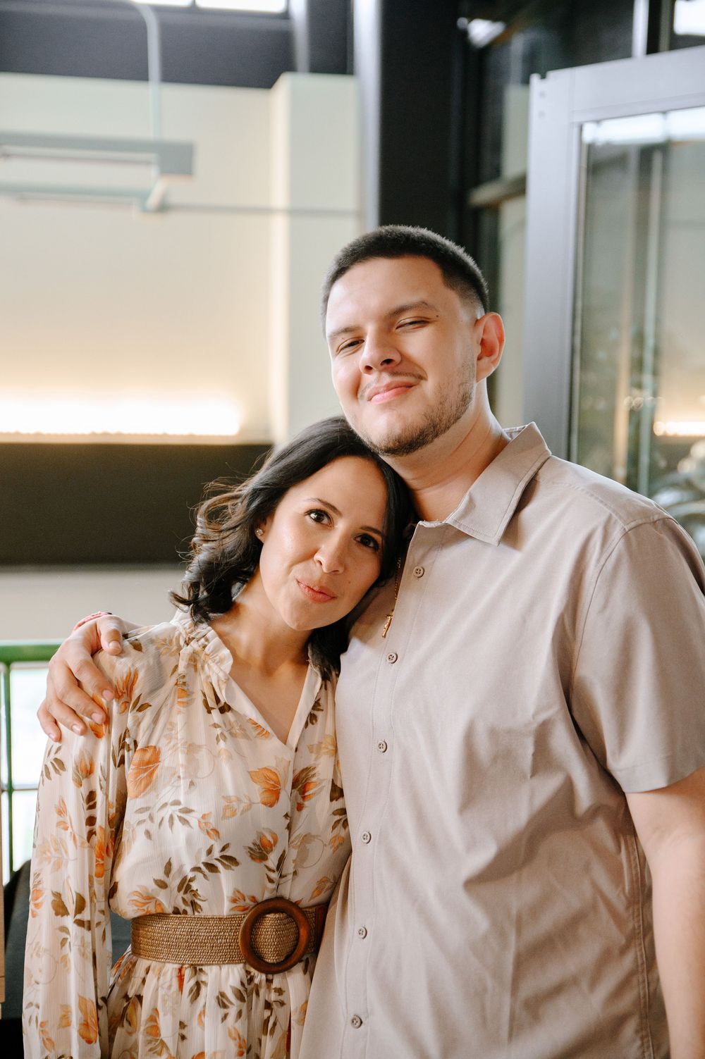 Couple posing together at a casual restaurant setting.