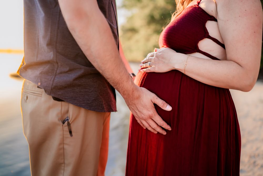 Multiple poses of a couple in burgundy and tan outfits embracing outdoors at sunset.