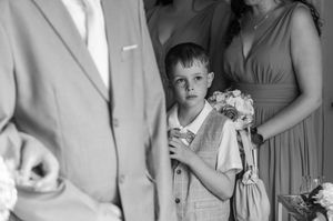 A black and white photo collage showing an array of wedding moments with bridal attire and candid captures.