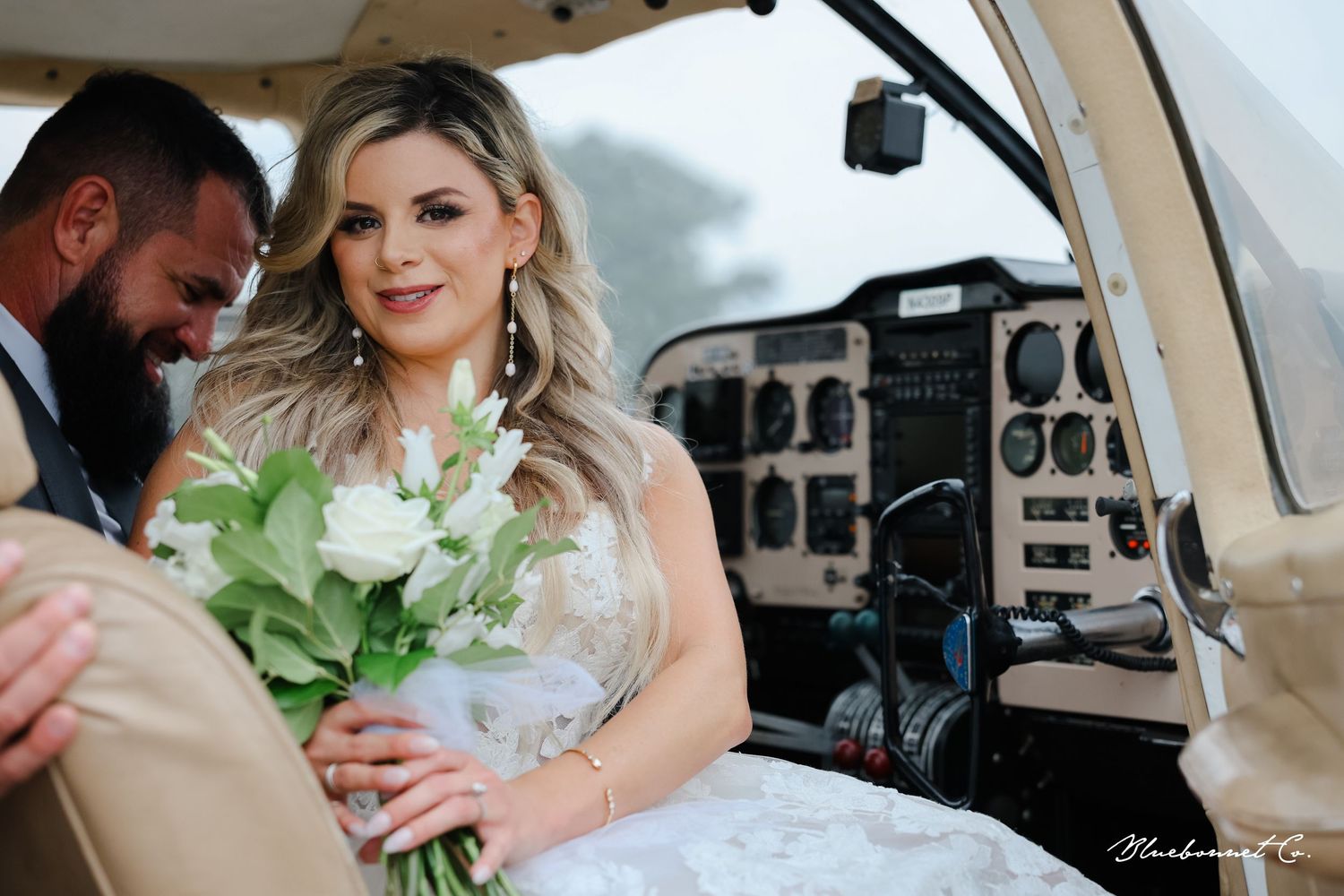 Wedding photography with white timeless florals for aero/airplane theme showing clusters of plane