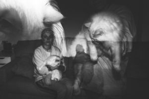 Black and white photo series showing dramatic poses and reactions in dark lighting conditions.