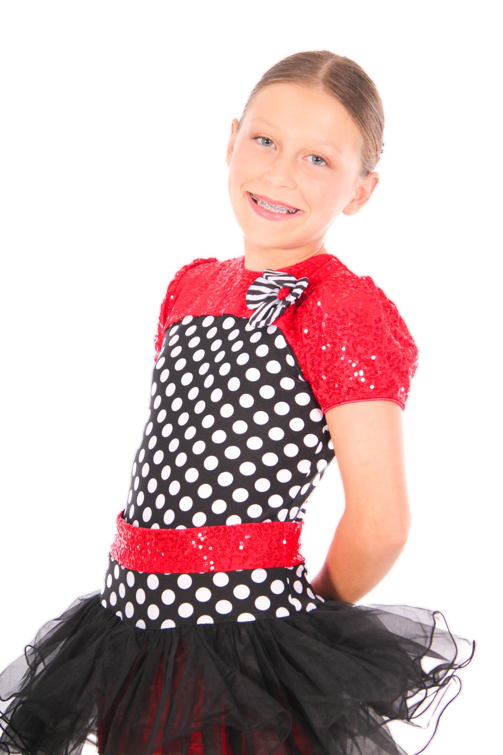 Dance costume featuring polka dot pattern with red sequin top and black tulle skirt.