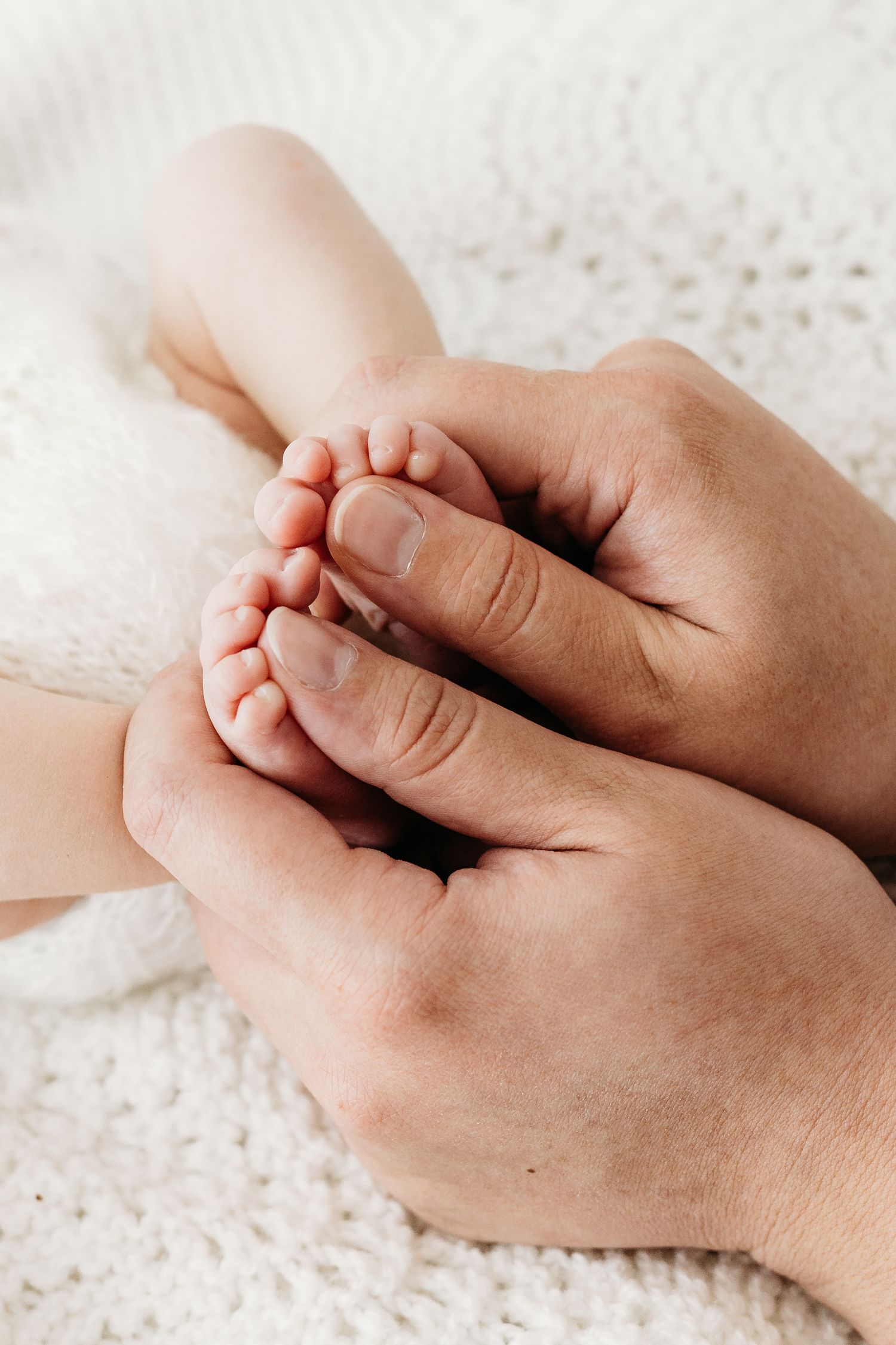 Newborn baby portrait details of tiny toes at Nottingham studio, peaceful and calm photography by Mapperley newborn photographer.